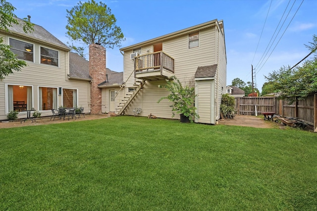 4790 Whispering Falls Dr, Houston, TX 77084 - rear view of property with a fenced backyard, a balcony, a chimney, and a patio