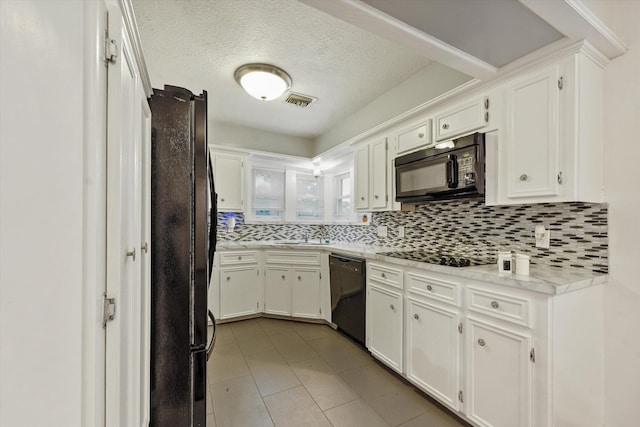 4790 Whispering Falls Dr, Houston, TX 77084 - kitchen with black appliances, tasteful backsplash, white cabinets, light tile patterned flooring, and a textured ceiling