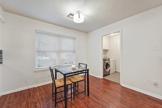 4790 Whispering Falls Dr, Houston, TX 77084 - dining area with wood finished floors, separate washer and dryer, and a textured ceiling