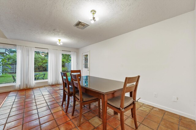 4790 Whispering Falls Dr, Houston, TX 77084 - dining area with a textured ceiling and light tile patterned floors