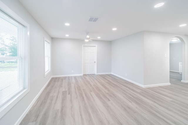6307 Westover St, Houston, TX 77087 - unfurnished room featuring arched walkways, ceiling fan, recessed lighting, and light wood-style flooring