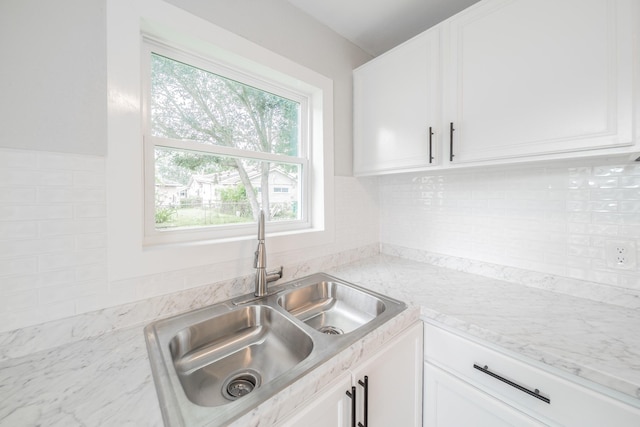 6307 Westover St, Houston, TX 77087 - kitchen featuring plenty of natural light, white cabinets, and backsplash