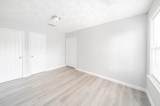 6307 Westover St, Houston, TX 77087 - unfurnished bedroom featuring light wood finished floors and a closet