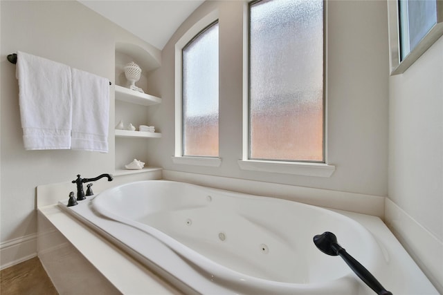 5714 Spring River Ln, Fulshear, TX 77441 - full bath with a tub with jets and lofted ceiling
