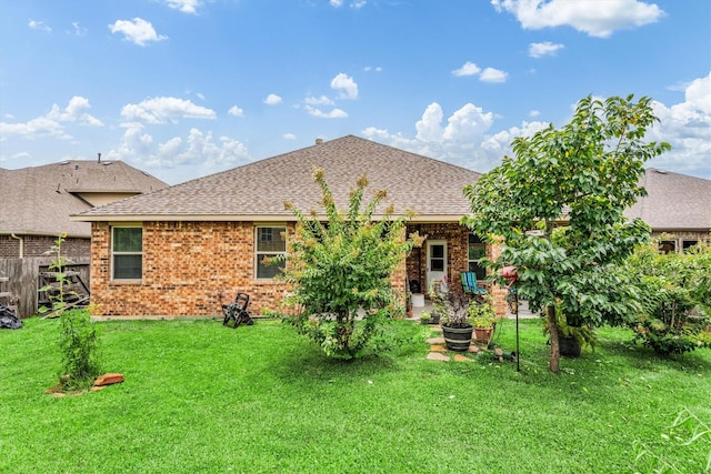 22911 Banff Brook Way, Tomball, TX 77375 - rear view of house with brick siding, a shingled roof, and a patio area