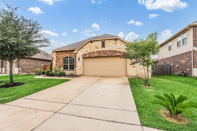 22911 Banff Brook Way, Tomball, TX 77375 - view of front of property featuring stone siding, driveway, an attached garage, and a shingled roof