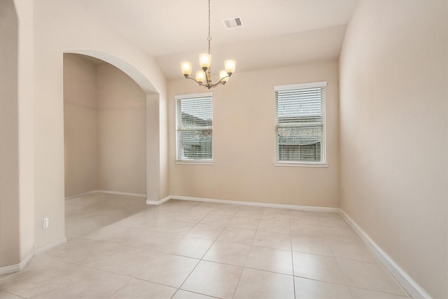22911 Banff Brook Way, Tomball, TX 77375 - spare room with a chandelier, light tile patterned flooring, and arched walkways