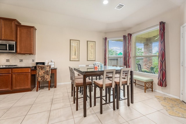 22911 Banff Brook Way, Tomball, TX 77375 - dining space featuring light tile patterned flooring and recessed lighting