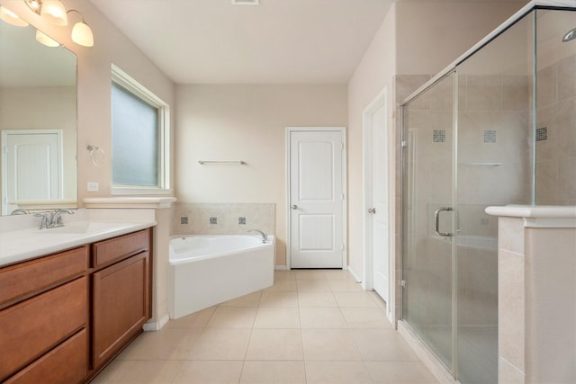 22911 Banff Brook Way, Tomball, TX 77375 - full bathroom with vanity, tile patterned floors, a bath, and a stall shower
