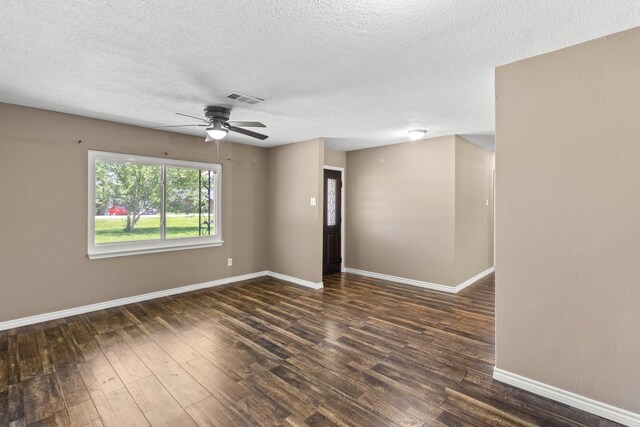 109 Timber Ln, Baytown, TX 77520 - spare room with ceiling fan, a textured ceiling, and dark wood-style floors