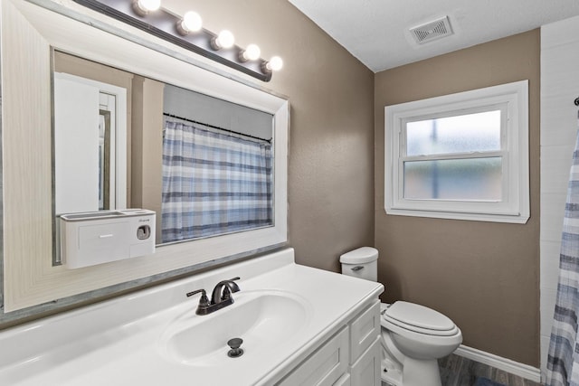 109 Timber Ln, Baytown, TX 77520 - bathroom featuring vanity and toilet