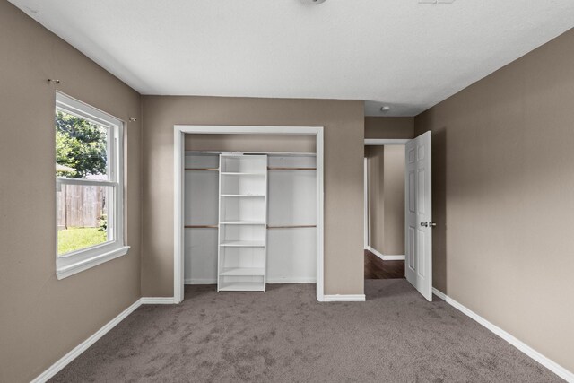 109 Timber Ln, Baytown, TX 77520 - unfurnished bedroom with carpet flooring and a closet