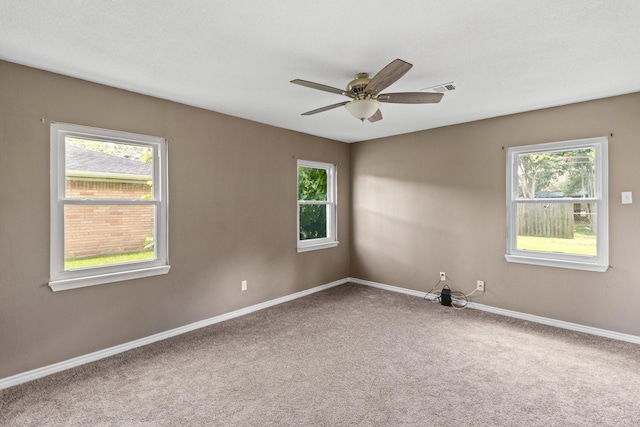 109 Timber Ln, Baytown, TX 77520 - spare room featuring carpet, healthy amount of natural light, and ceiling fan