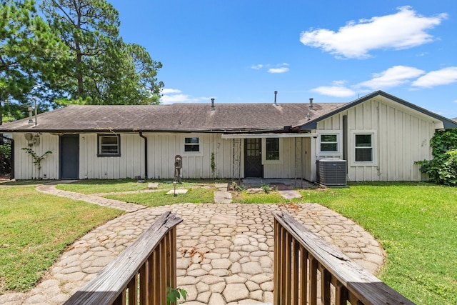 109 Timber Ln, Baytown, TX 77520 - rear view of property with a patio, a lawn, roof with shingles, and board and batten siding