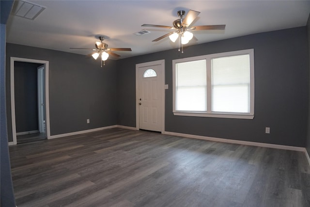 6803 6th St, Hitchcock, TX 77563 - foyer entrance featuring ceiling fan and dark wood-style flooring