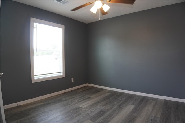 6803 6th St, Hitchcock, TX 77563 - spare room featuring dark wood-style flooring and a ceiling fan