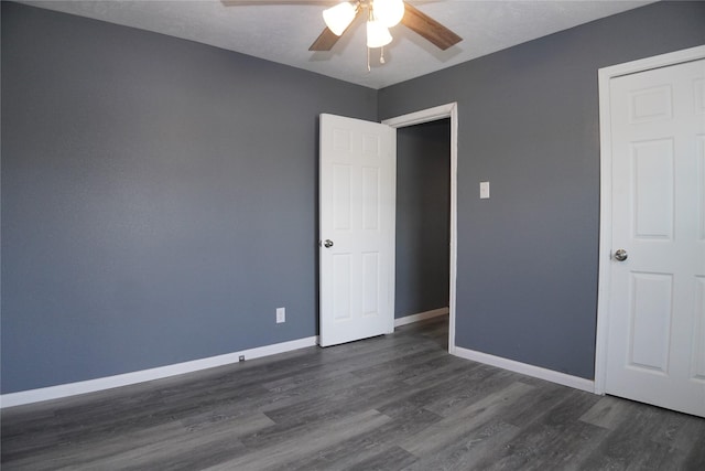 6803 6th St, Hitchcock, TX 77563 - empty room with a ceiling fan and dark wood-style floors