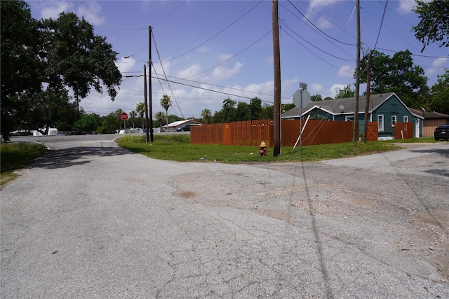 6803 6th St, Hitchcock, TX 77563 - view of asphalt road with traffic signs