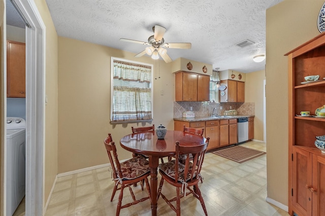 11815 Sharpview Dr, Houston, TX 77072 - dining area featuring washer / clothes dryer, light floors, ceiling fan, and a textured ceiling