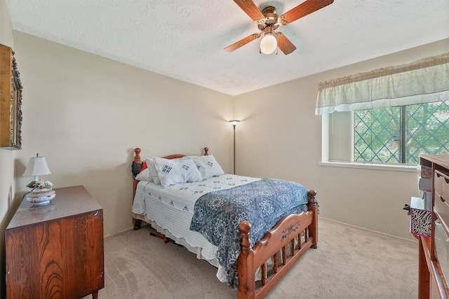 11815 Sharpview Dr, Houston, TX 77072 - bedroom featuring light colored carpet, a ceiling fan, and a textured ceiling