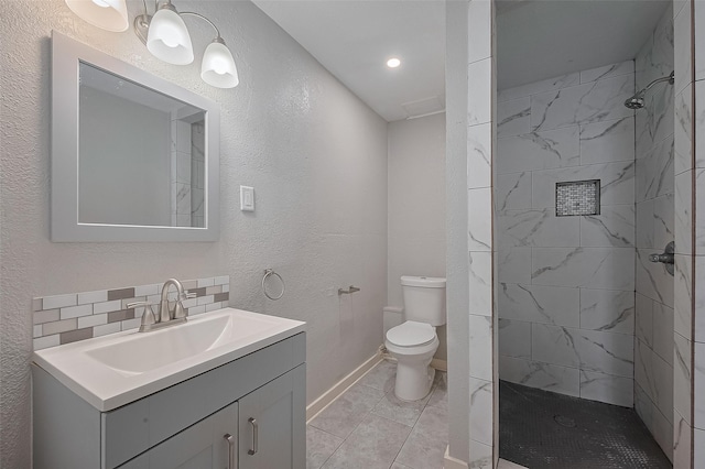 1813 Hatwell St, Houston, TX 77023 - full bathroom featuring vanity, tiled shower, and a textured wall