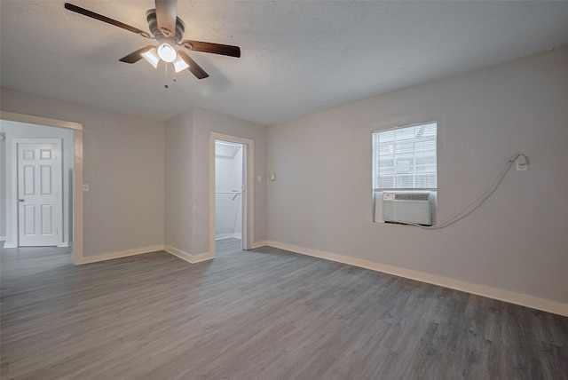1813 Hatwell St, Houston, TX 77023 - unfurnished room featuring wood finished floors, cooling unit, a ceiling fan, and a textured ceiling