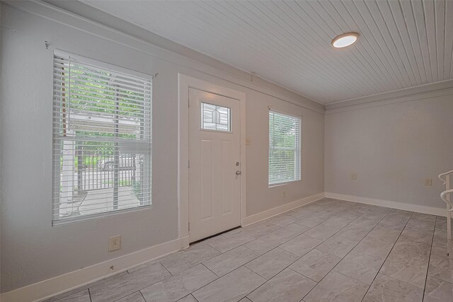 1813 Hatwell St, Houston, TX 77023 - foyer featuring ornamental molding and baseboards