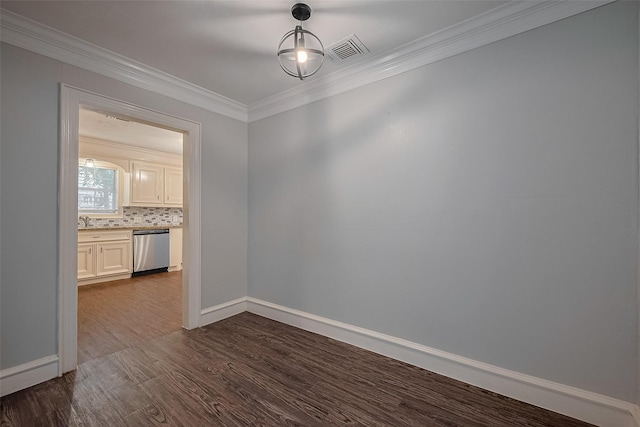 1813 Hatwell St, Houston, TX 77023 - unfurnished dining area with ornamental molding and dark wood-style floors