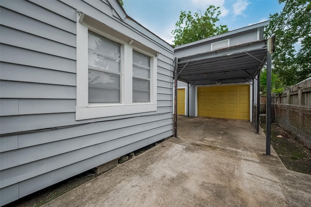 1813 Hatwell St, Houston, TX 77023 - view of side of property featuring concrete driveway and a detached garage