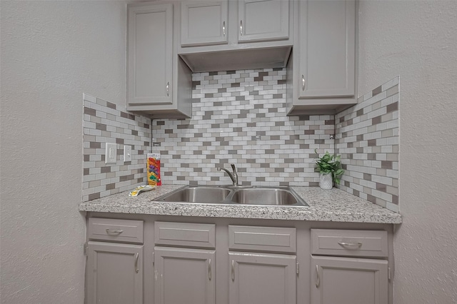 1813 Hatwell St, Houston, TX 77023 - kitchen with backsplash, gray cabinets, and light countertops