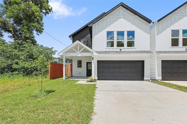 7410 Hezekiah Ln, Houston, TX 77088 - modern farmhouse style home with board and batten siding, an attached garage, and driveway