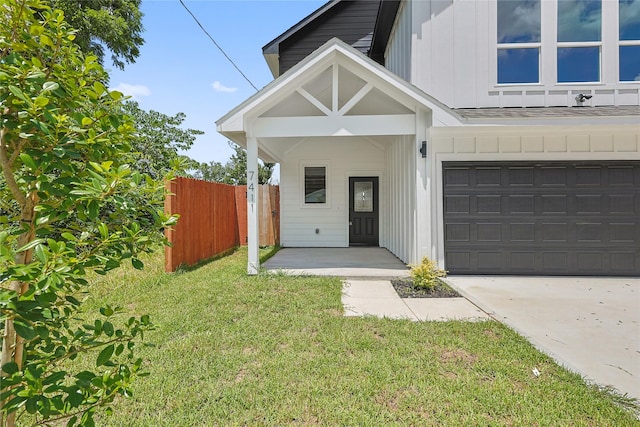 7410 Hezekiah Ln, Houston, TX 77088 - view of front facade with board and batten siding, concrete driveway, and a shingled roof