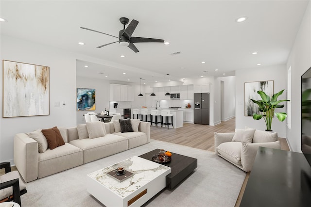 7410 Hezekiah Ln, Houston, TX 77088 - living area with a ceiling fan, recessed lighting, and light wood-type flooring