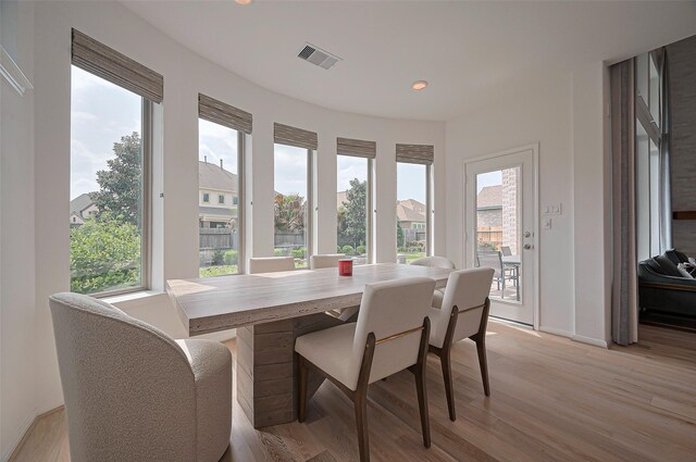 2611 Oakland Park Dr, Conroe, TX 77385 - dining space with light wood-type flooring and recessed lighting