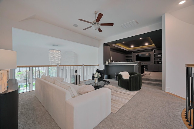 2611 Oakland Park Dr, Conroe, TX 77385 - living area featuring a ceiling fan, carpet, a chandelier, recessed lighting, and a raised ceiling