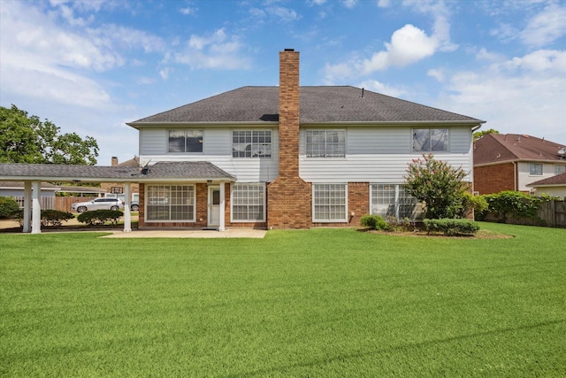 2125 Tipperary Dr, Pearland, TX 77581 - back of house featuring a chimney, brick siding, a patio area, a shingled roof, and a carport