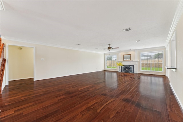 2125 Tipperary Dr, Pearland, TX 77581 - unfurnished living room featuring wood finished floors, a ceiling fan, a fireplace, and ornamental molding