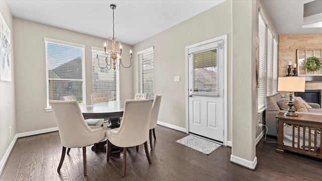 14926 Kenton Place Ln, Cypress, TX 77429 - dining room featuring a chandelier, dark wood finished floors, and plenty of natural light