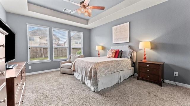 14926 Kenton Place Ln, Cypress, TX 77429 - carpeted bedroom with a tray ceiling and a ceiling fan