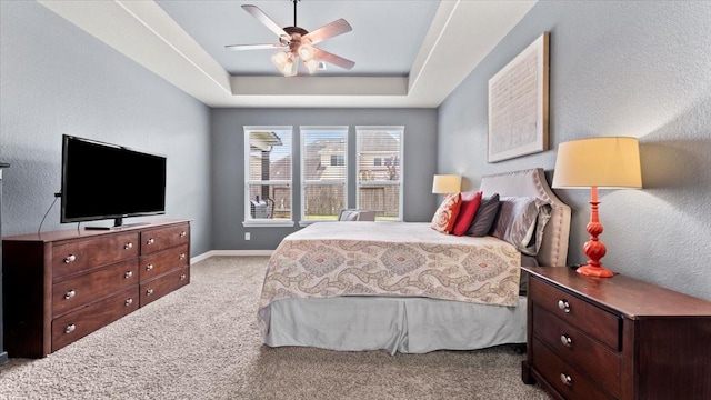 14926 Kenton Place Ln, Cypress, TX 77429 - bedroom with carpet, a raised ceiling, and ceiling fan