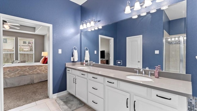 14926 Kenton Place Ln, Cypress, TX 77429 - ensuite bathroom with double vanity, tile patterned flooring, ceiling fan, and a shower with door