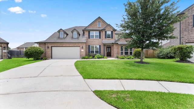 14926 Kenton Place Ln, Cypress, TX 77429 - view of front of home featuring brick siding, driveway, and a garage