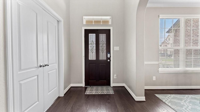 14926 Kenton Place Ln, Cypress, TX 77429 - entryway featuring dark wood-type flooring, crown molding, and arched walkways