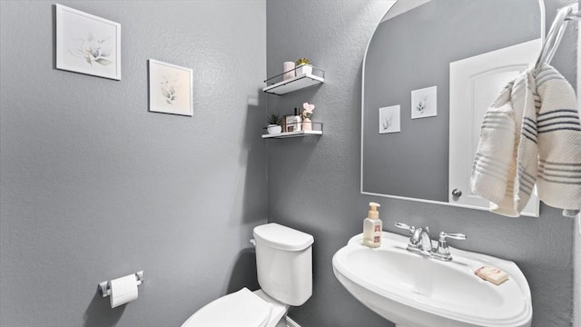 14926 Kenton Place Ln, Cypress, TX 77429 - bathroom featuring a sink and a textured wall