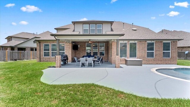 14926 Kenton Place Ln, Cypress, TX 77429 - rear view of house featuring a fenced backyard, brick siding, a patio area, and a ceiling fan