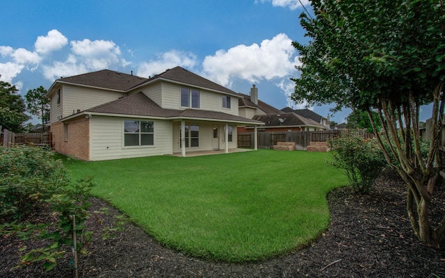 11610 Cross Spring Dr, Pearland, TX 77584 - rear view of house featuring a patio, a fenced backyard, a shingled roof, and brick siding