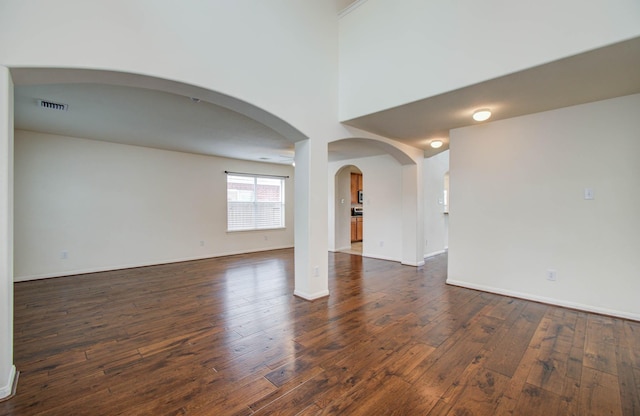 11610 Cross Spring Dr, Pearland, TX 77584 - unfurnished room featuring dark wood finished floors and arched walkways