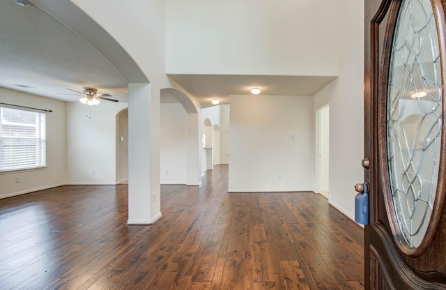 11610 Cross Spring Dr, Pearland, TX 77584 - entrance foyer featuring arched walkways, a ceiling fan, and dark wood-type flooring