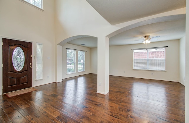 11610 Cross Spring Dr, Pearland, TX 77584 - entrance foyer with arched walkways, healthy amount of natural light, a ceiling fan, and a towering ceiling