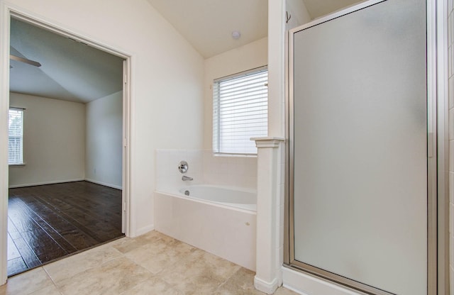 11610 Cross Spring Dr, Pearland, TX 77584 - full bath featuring a bath, plenty of natural light, a shower stall, lofted ceiling, and tile patterned flooring